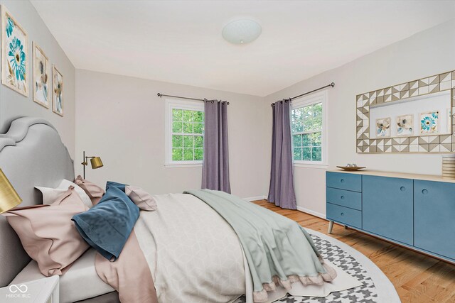 6146 Rucker Rd, Indianapolis, IN 46220 - bedroom with light wood-type flooring and baseboards