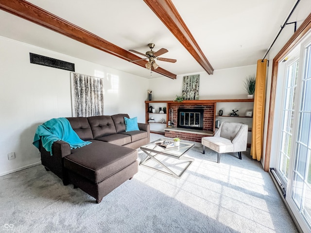 6146 Rucker Rd, Indianapolis, IN 46220 - living room with carpet, beam ceiling, plenty of natural light, ceiling fan, and a brick fireplace