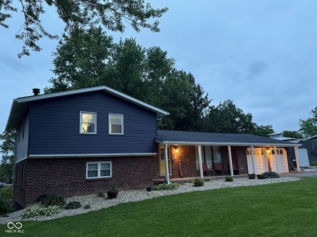 75 Byram Blvd, Martinsville, IN 46151 - split level home featuring covered porch, brick siding, and a front lawn