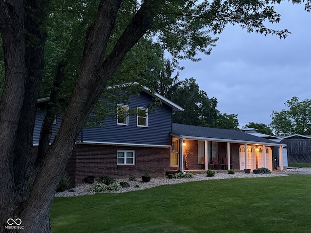 75 Byram Blvd, Martinsville, IN 46151 - tri-level home featuring a porch, brick siding, and a front lawn