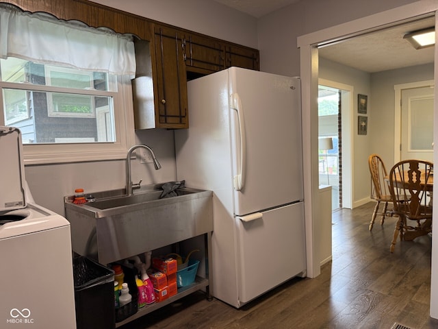 75 Byram Blvd, Martinsville, IN 46151 - kitchen featuring freestanding refrigerator, washer / dryer, dark wood-style floors, a sink, and baseboards