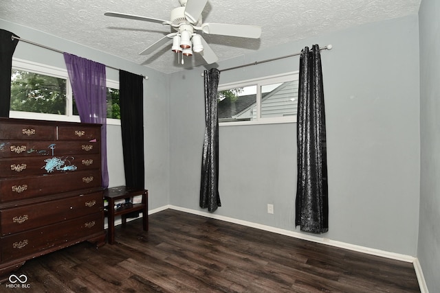 4751 N Longworth Ave, Indianapolis, IN 46226 - bedroom with a textured ceiling, wood finished floors, multiple windows, baseboards, and a ceiling fan