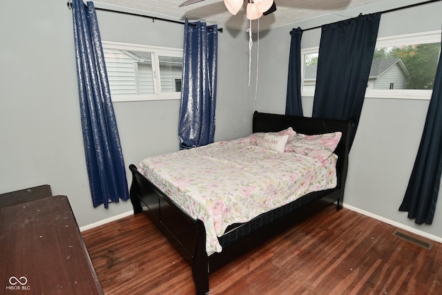 4751 N Longworth Ave, Indianapolis, IN 46226 - bedroom featuring baseboards, wood finished floors, and a textured ceiling