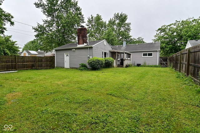 4751 N Longworth Ave, Indianapolis, IN 46226 - rear view of property with a chimney