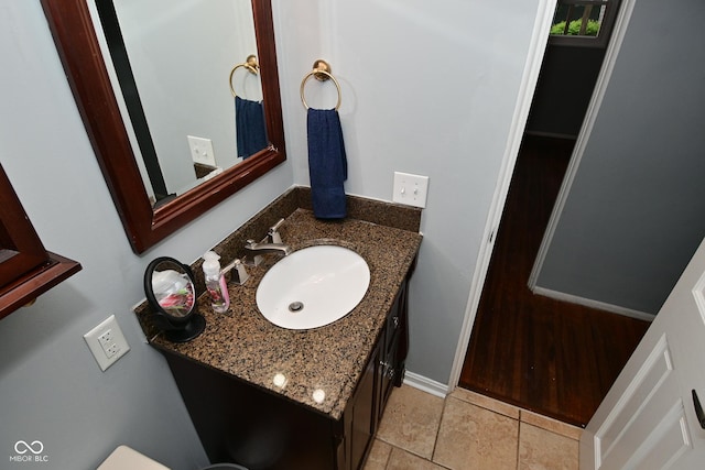 4751 N Longworth Ave, Indianapolis, IN 46226 - half bathroom with vanity and tile patterned flooring