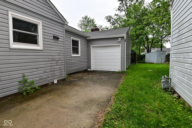 4751 N Longworth Ave, Indianapolis, IN 46226 - garage featuring asphalt driveway