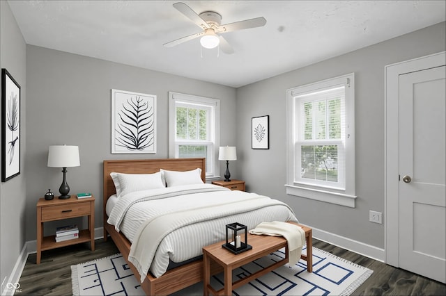 1915 Albany St, Beech Grove, IN 46107 - bedroom featuring dark wood-style flooring, baseboards, and a ceiling fan