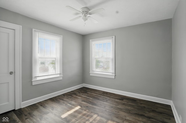 1915 Albany St, Beech Grove, IN 46107 - spare room featuring baseboards, ceiling fan, and dark wood-type flooring