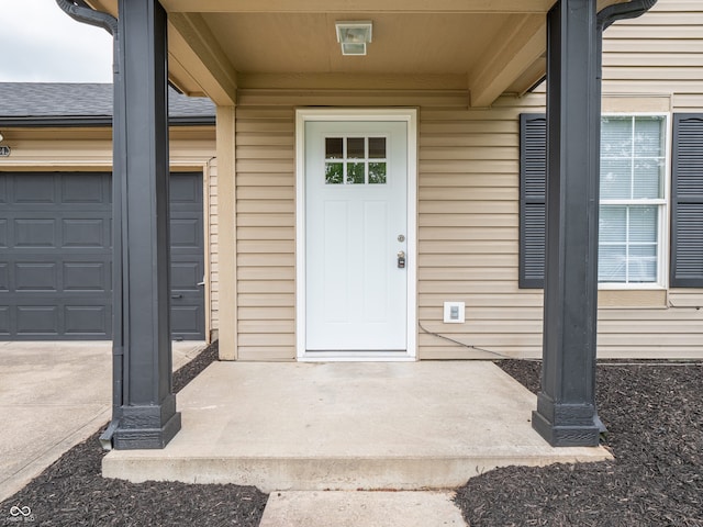 3734 Lacebark Dr, Indianapolis, IN 46235 - view of exterior entry with a shingled roof and an attached garage