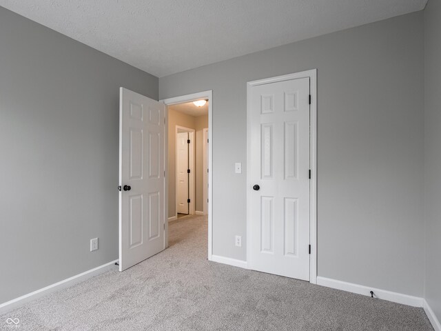 3734 Lacebark Dr, Indianapolis, IN 46235 - unfurnished bedroom with carpet floors and baseboards