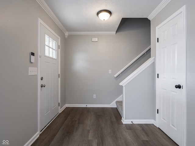 3734 Lacebark Dr, Indianapolis, IN 46235 - foyer entrance with stairway, dark wood-type flooring, crown molding, baseboards, and a textured ceiling