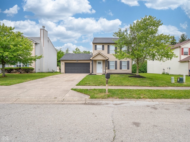 3734 Lacebark Dr, Indianapolis, IN 46235 - view of front of home featuring an attached garage, concrete driveway, and a front lawn