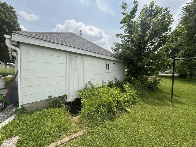 5553 N County Road 10 E, Greensburg, IN 47240 - view of property exterior with a lawn and a shingled roof