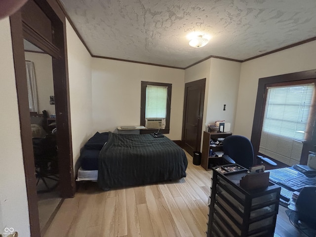 5553 N County Road 10 E, Greensburg, IN 47240 - bedroom featuring light wood-type flooring, a desk, a textured ceiling, multiple windows, and ornamental molding