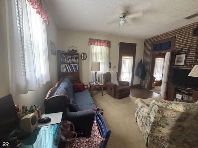 5553 N County Road 10 E, Greensburg, IN 47240 - carpeted living room featuring a ceiling fan and a textured ceiling