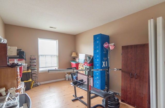 8056 Maple Stream Blvd, Indianapolis, IN 46217 - workout room with wood finished floors and baseboards
