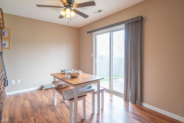 8056 Maple Stream Blvd, Indianapolis, IN 46217 - dining room with healthy amount of natural light, ceiling fan, wood finished floors, and baseboards