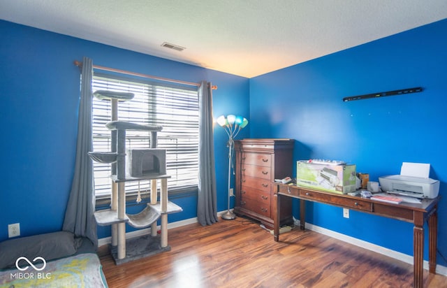 8056 Maple Stream Blvd, Indianapolis, IN 46217 - office area featuring wood finished floors, baseboards, and a textured ceiling