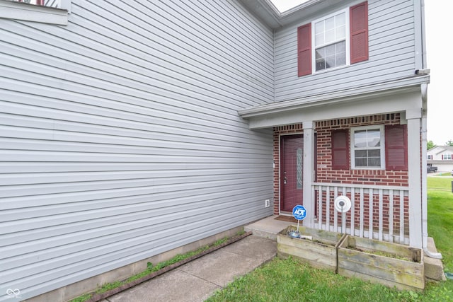 8056 Maple Stream Blvd, Indianapolis, IN 46217 - doorway to property with brick siding