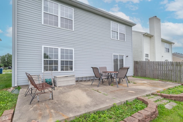8056 Maple Stream Blvd, Indianapolis, IN 46217 - rear view of property featuring a patio and a chimney