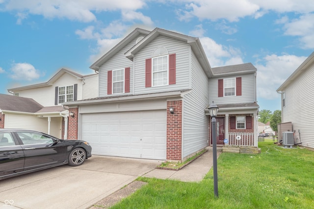 8056 Maple Stream Blvd, Indianapolis, IN 46217 - traditional-style home with an attached garage, driveway, a front lawn, brick siding, and central AC unit