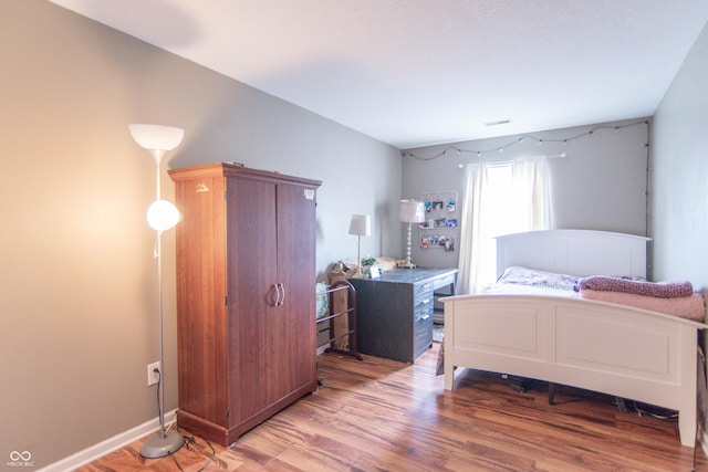8056 Maple Stream Blvd, Indianapolis, IN 46217 - bedroom with light wood-style floors and baseboards