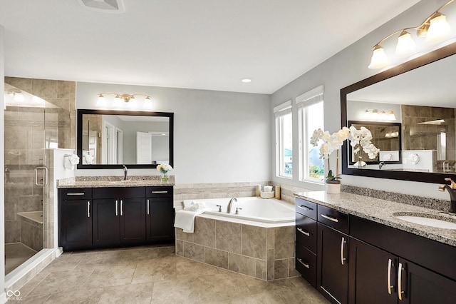 2789 W High Grove Cir, Zionsville, IN 46077 - full bath featuring a stall shower, two vanities, a garden tub, and tile patterned floors
