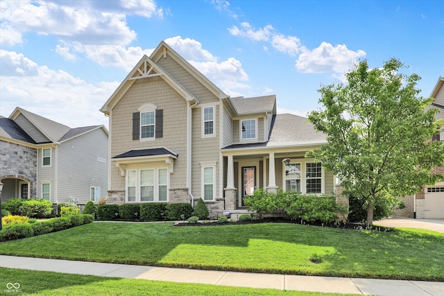 2789 W High Grove Cir, Zionsville, IN 46077 - craftsman inspired home with a front yard, stone siding, and covered porch