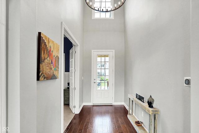2789 W High Grove Cir, Zionsville, IN 46077 - entryway featuring healthy amount of natural light, a chandelier, dark wood finished floors, and a high ceiling