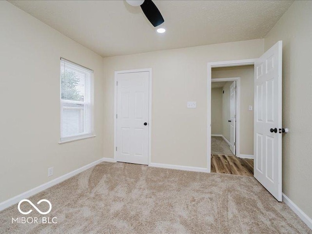 3558 N Gladstone Ave, Indianapolis, IN 46218 - unfurnished bedroom featuring carpet, baseboards, and a ceiling fan