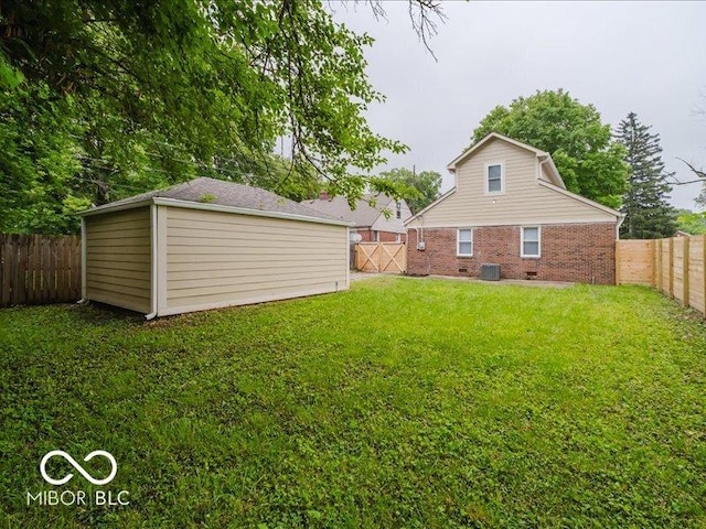 3558 N Gladstone Ave, Indianapolis, IN 46218 - view of yard featuring central AC and an outbuilding