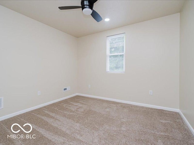 3558 N Gladstone Ave, Indianapolis, IN 46218 - carpeted spare room featuring a ceiling fan, baseboards, and recessed lighting