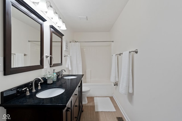6927 Rose Tree Ct, Indianapolis, IN 46237 - full bath with toilet, double vanity, shower / tub combo with curtain, and wood finished floors