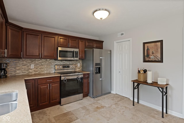 6927 Rose Tree Ct, Indianapolis, IN 46237 - kitchen with appliances with stainless steel finishes, backsplash, dark brown cabinets, and a sink