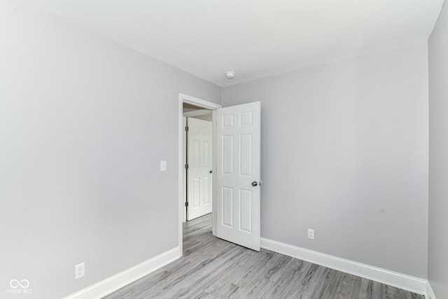 1820 Hemlock Ln, Plainfield, IN 46168 - spare room with light wood-style flooring, baseboards, and a smoke detector