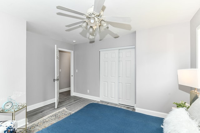 1820 Hemlock Ln, Plainfield, IN 46168 - bedroom with wood finished floors, baseboards, a closet, and a ceiling fan