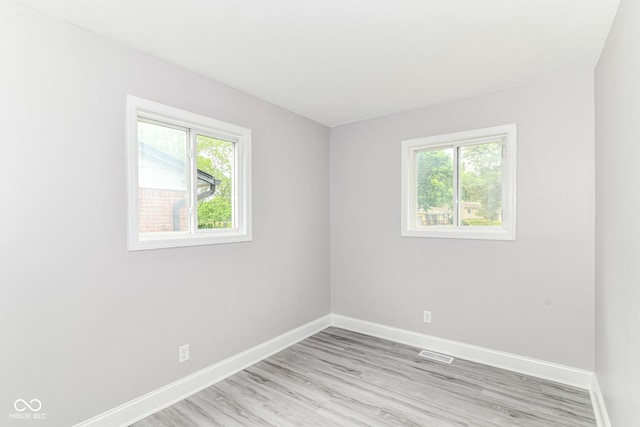 1820 Hemlock Ln, Plainfield, IN 46168 - spare room with healthy amount of natural light, baseboards, and light wood-type flooring