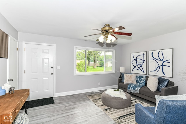 1820 Hemlock Ln, Plainfield, IN 46168 - living room with ceiling fan, light wood finished floors, and baseboards