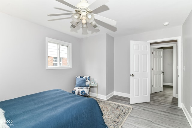 1820 Hemlock Ln, Plainfield, IN 46168 - bedroom with baseboards, wood finished floors, and a ceiling fan