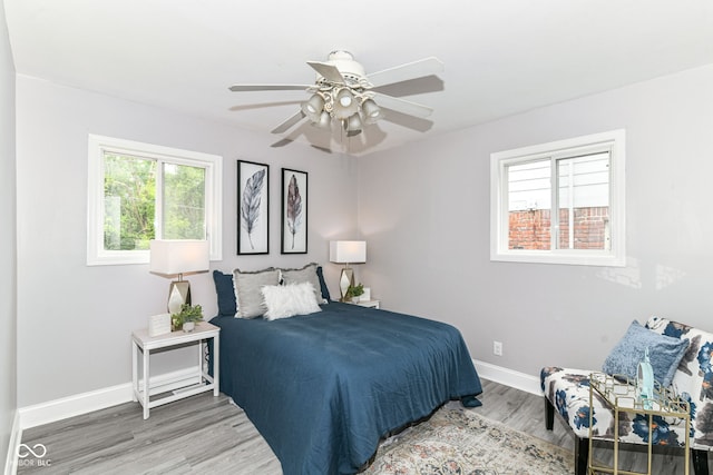 1820 Hemlock Ln, Plainfield, IN 46168 - bedroom featuring wood finished floors, baseboards, and a ceiling fan