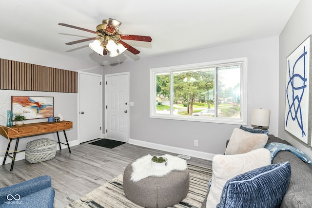 1820 Hemlock Ln, Plainfield, IN 46168 - living area with a ceiling fan, wood finished floors, and baseboards