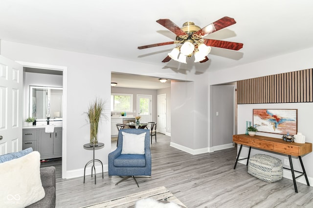1820 Hemlock Ln, Plainfield, IN 46168 - living area featuring wood finished floors, ceiling fan, and baseboards