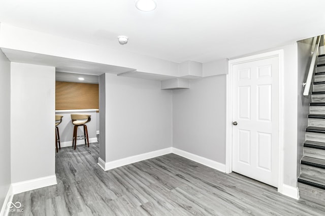 1820 Hemlock Ln, Plainfield, IN 46168 - finished below grade area with stairway, baseboards, and wood finished floors