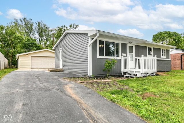 1820 Hemlock Ln, Plainfield, IN 46168 - view of front of home with a detached garage, an outbuilding, and a front yard