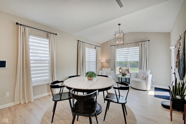 4163 Ironclad Dr, Bargersville, IN 46106 - dining area with light wood-type flooring, a chandelier, and lofted ceiling