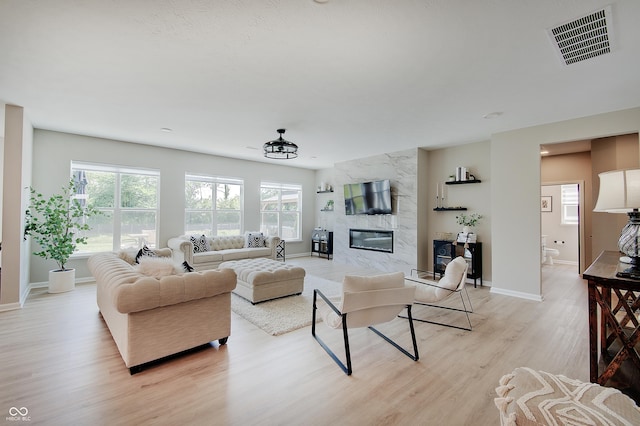 4163 Ironclad Dr, Bargersville, IN 46106 - living area with light wood finished floors and a high end fireplace