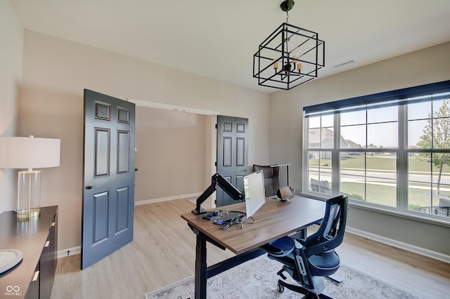 4163 Ironclad Dr, Bargersville, IN 46106 - office area with light wood finished floors and a chandelier