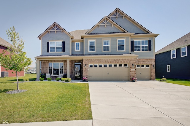 4163 Ironclad Dr, Bargersville, IN 46106 - craftsman-style home with a garage, driveway, a front yard, and brick siding