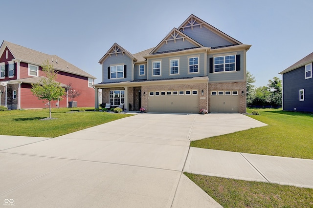 4163 Ironclad Dr, Bargersville, IN 46106 - craftsman-style home featuring brick siding, driveway, an attached garage, and a front lawn
