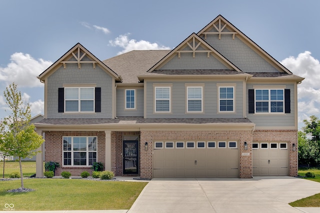 4163 Ironclad Dr, Bargersville, IN 46106 - craftsman-style house with brick siding, an attached garage, concrete driveway, a front yard, and a shingled roof